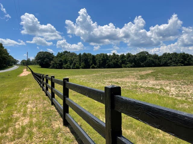 Concrete ranch rail fence installed on a Florida property